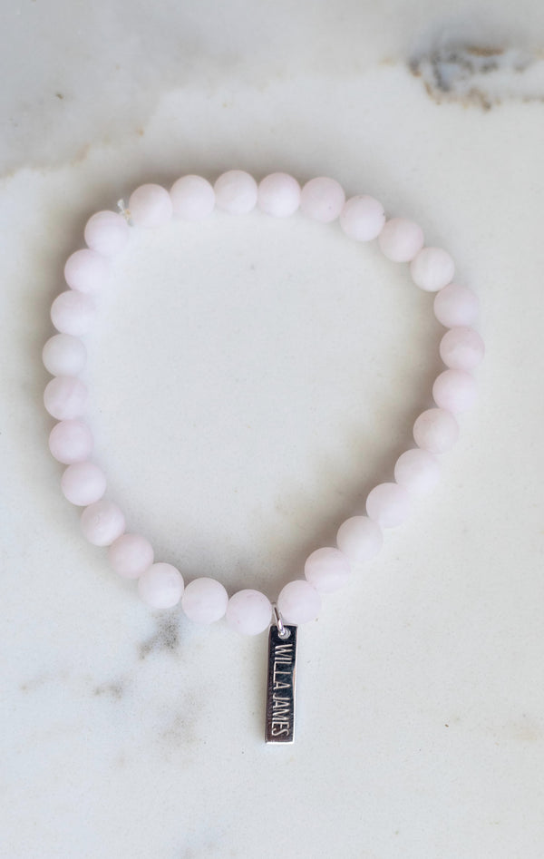 Health and Stability White Rhodium Plate Matte Rose Quartz Stretch Bracelet